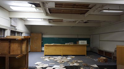 Room in the WAC with ceiling tiles on the floor